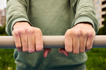 A Firm Grip on a Fitness Bar in a Vibrant Urban Scene, Engaging in Active Training