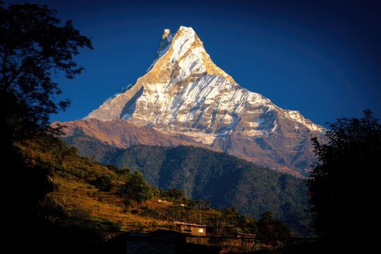 Majestic mountain peak, snow-capped, sunlit,  with valley and trees
