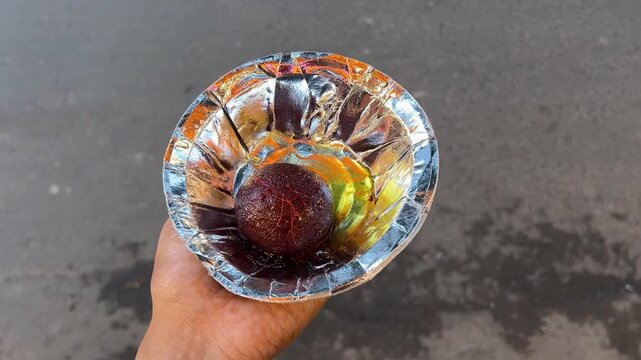 Street style gulab jamun sold by local vendor in Kolkata