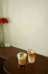 Closeup of Iced Caramel Macchiato at the coffee shop, Caramel Macchiato is a classic macchiato...