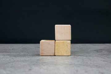 Blank wooden cubes on the table with copy space, empty wooden cubes for input wording, and an...