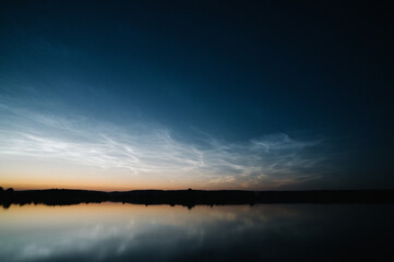 NLC Noctilucent Clouds over Lake Orle at sunset