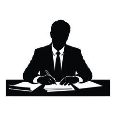 Businessman writing at desk with books and papers sitting