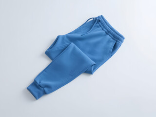 A pair of women's blue sweatpants casually draped on a plain white background.  The sweatpants are made of a soft, comfortable-looking fabric.