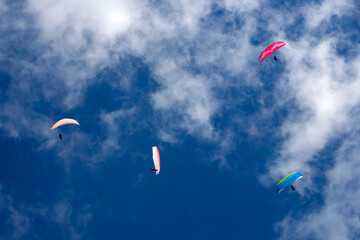 Paragliders above the alps in the dolomites, South Tyrol