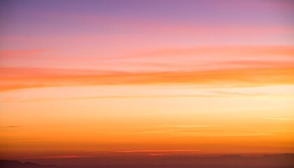 Fototapeta premium Serene Sunset Hues Over Distant Mountains