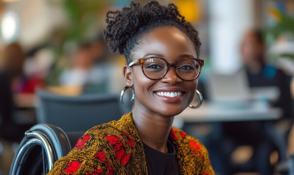 Inclusive image of a happy smiling Black African American disabled office LGBTQ+ colleague in a wheelchair, representing the diversity and inclusivity of modern workspaces, Generative AI - Powered by Adobe