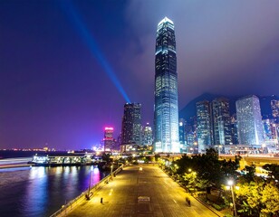 Obraz premium at night featuring a wide, empty plaza flanked by modern high-rise