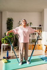 Old Lady Performs Strength Exercise With Elastic Band in Home Setting