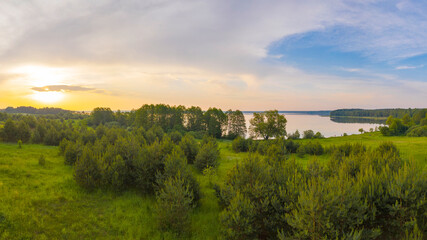 a large lake in a summer forest