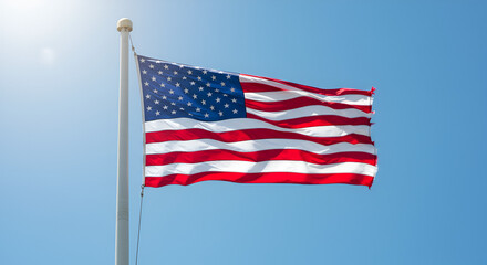 Obraz premium American flag waving in a clear blue sky