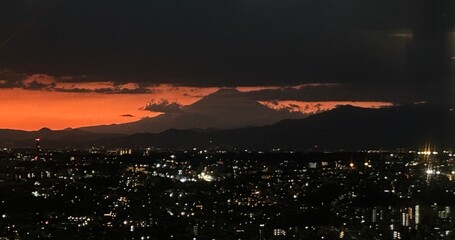 Golden Sunset Over Mount Fuji with Cityscape Silhouette