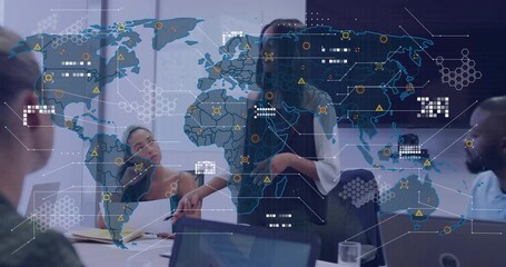 Presenter gesturing pen triggers world map overlay animating data icons during business meeting - Powered by Adobe