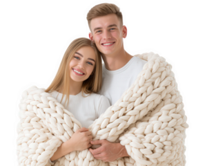 Couple wrapped in cozy chunky knit blanket, smiling, standing close together, wearing white clothing, isolated on transparency background, expressing warmth and happiness