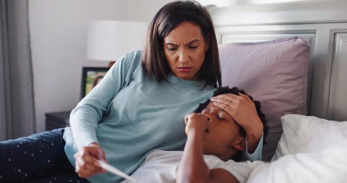 Worried mom, sick child or fever with thermometer in bed for illness, influenza or allergy in home. African woman, kid or checking temperature with son for monitoring flu, cold or symptoms in bedroom