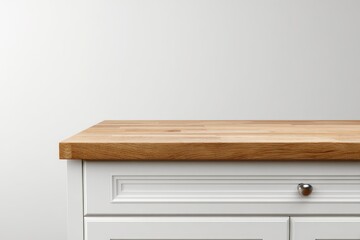 Close-up of a light-wood countertop on white cabinets