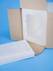 Close-up of styrofoam cooler packaging components for dry ice transport