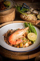 Pad Thai with thin noodles, dry, and tamarind sauce mixed with eggs and minced tofu. Thai food.