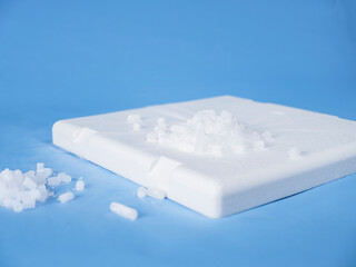 Dry ice pellets displayed on white styrofoam storage tray