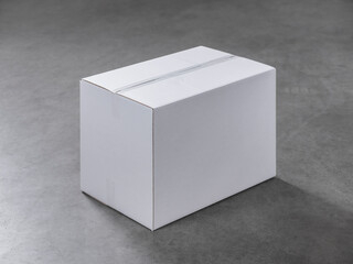 Closed white cardboard shipping box on gray concrete surface