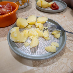 Steam over appetizing boiled potatoes with dill. boiled potatoes on a plate. Close up. hack...