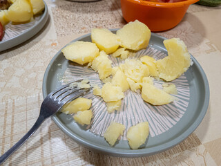Steam over appetizing boiled potatoes with dill. boiled potatoes on a plate. Close up. hack...