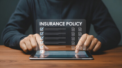 Person reviewing insurance policy details on digital tablet, confirming coverage and benefits with secure digital access