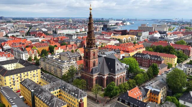 orbiting drone shot of Copenhagen famous church of Our Saviour, aerial view of downtown Copenhagen, capital of Denmark, Danish capital drone view