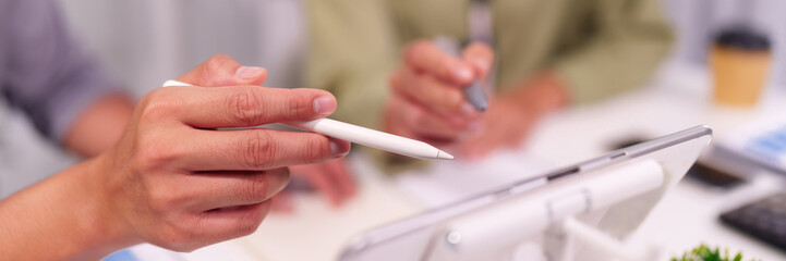 Asian adult hands use stylus tablet digital business meeting collaboration office environment...
