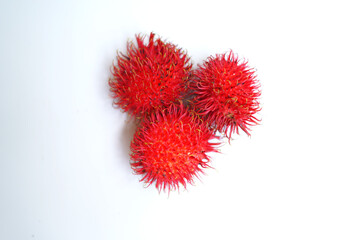 Organic Red Rambutan Fruit on Clean White Background.