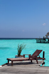 A serene view with clear turquoise water and bright blue skies