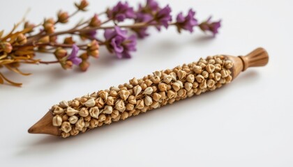 a high resolution, ultra sharp isolated ritual candle snuffer made from pressed wildflower, placed on a pure white background with no shadow or minimal soft shadows only
