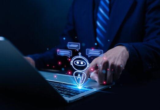 Man using laptop to chat with AI Chatbot Assistant or Artificial Intelligence Technology, Holographic Robot Application and Global Connectivity