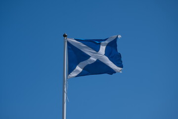 Scottish flag on a flagpole flapping in the wind, Saltire, Saint Andrew's Cross