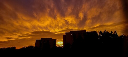 A breathtaking and stunning sunset unfolds over an enchanting urban landscape filled with beauty