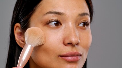 Applying Makeup with Brush for a Flawless Complexion