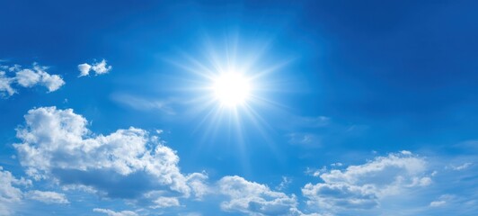 The Bright Sun Illuminating a Clear Blue Sky with Fluffy Clouds