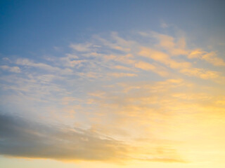 Fototapeta premium Sky sunset evening sunrise cloud weather dramatic landscape goldent and indigo color gradient pastel horizon, twilight yellow golden reflection morning nature environment energy ecosystem change