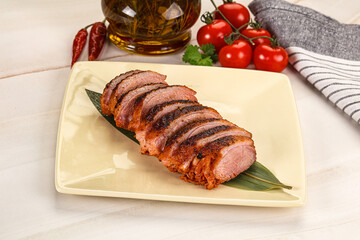 Sliced duck breast baked with cherry