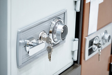 Classic safe with analog wheel combination lock, keyhole and silver door handle. Security cabinet...