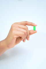 vitamin E capsule with hand image