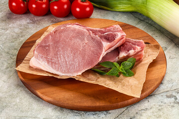 Raw pork steak loin with bone