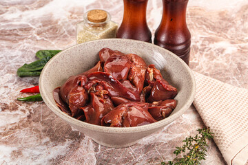 Raw uncokked chicken liver in the bowl