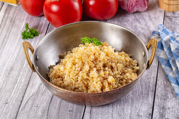 Vegan cuisine - boiled bulgur garnish