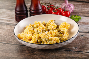 Scrambled egg omelet with green peas