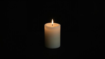 A simple small white candle illuminating the night, intended for spiritual prayers and remembering the deceased