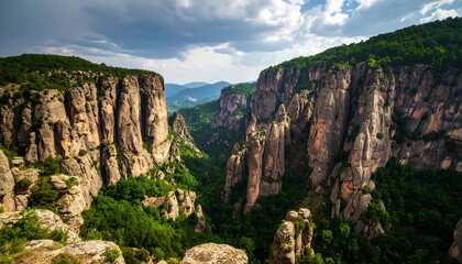 Naklejka premium Dramatic Vratsata mountain cliffs landscape with moody sky and green foliage