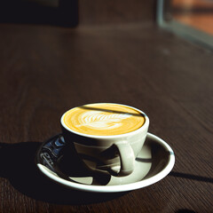 Cup of Coffee on Wooden Table