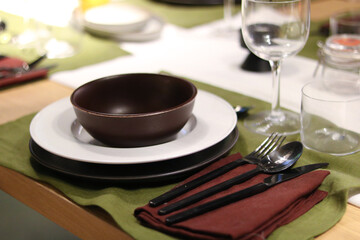 Elegant Dining Table Setting with Plates and Cutlery