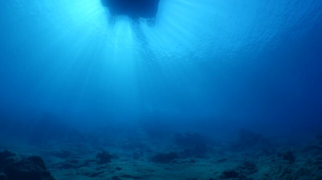 boat moves away underwater  shot